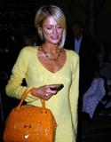 Paris Hilton in yellow at night in Hollywood